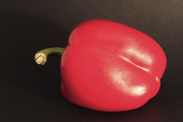 red bell pepper on black background