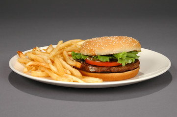 hamburger and fries on neutral background