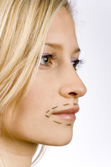 Fototapeta premium face of young woman prepared to plastic surgery