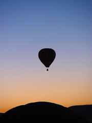 Hot air balloon on sunrise sky