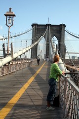 tourist on the brooklyn bridge