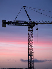 sunset and construction crane