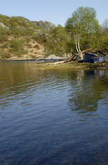 mountain lake and boat