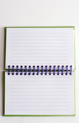 spiral bound note pad on white background