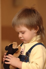 girl looking at toy dog