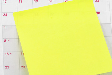 blank notepaper sticking on calendar