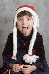 little girl sticked out one's tongue.