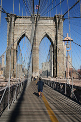 man jogging brooklyn bridge