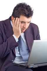 shocked businessman working on a laptop