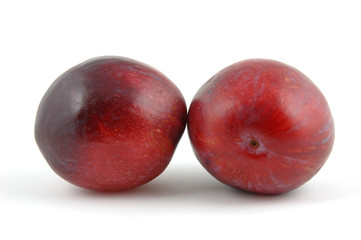 plums in isolated white background
