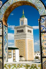 Peel and stick wall murals Tunisia mosque tower - framed with ornamental arch in tuni