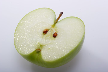 fruit,  a green apple, with a tail