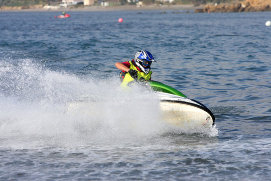 young man speeding along on jetbike during a race