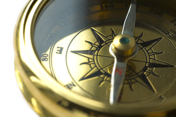 Obraz premium old style gold compass on white background