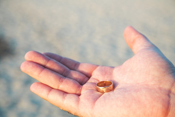 man proposing on the beach