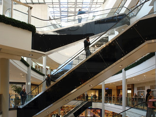 shoppers on elevators