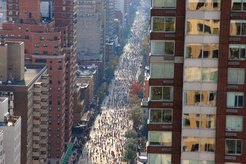 people running down the street in a marathon