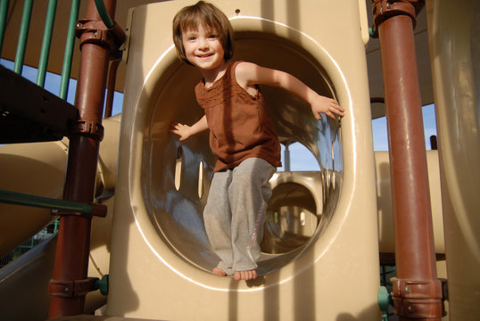 adorable young girl on slide