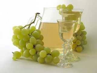 light wine in glasses and light grapes
