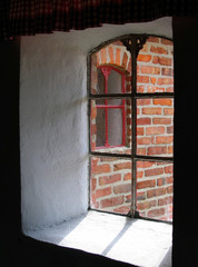 view from the window of an old brick house