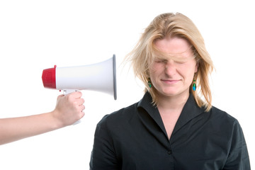 businesswoman with megaphone held to her head