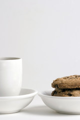 coffee and stack of chocolate chips cookies