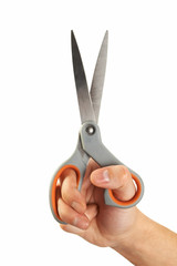 hand holding scissors
