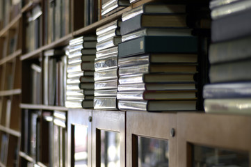 bookshelves piled with books