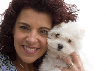 woman and bichon dog