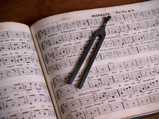 shaped note hymnal with tuning fork