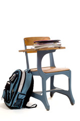 empty school desk with supplies