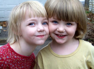 two sisters cheek to cheek