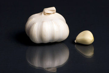 garlic bulb on black background