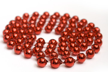 red beads on white background