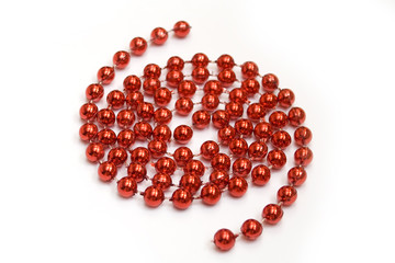 arrangement of red beads on white background