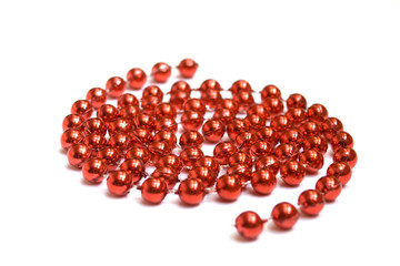 arrangement of red beads on white background