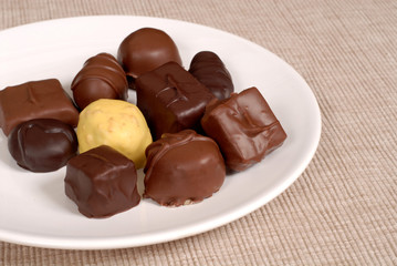 variety of chocolates on a white plate