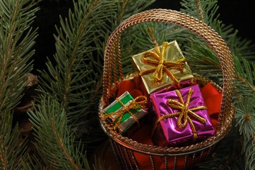 basket of presents in tree boughs