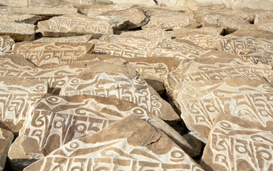 mani stones (stones with buddhistic inscriptions)