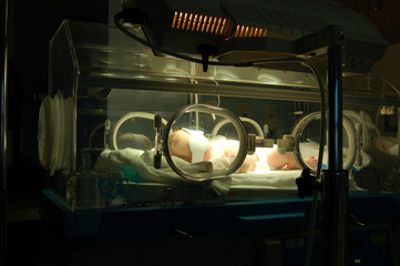 newborn in isolette 3