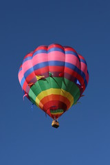 brightly colored hot air balloon flying