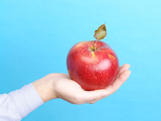 female palm with red apple