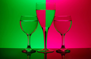 three glasses on neon background