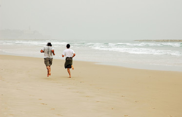 jogging on winter beach