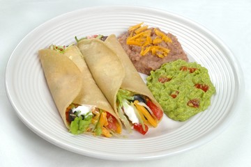 mexican food - tacos, beans, and guacamole
