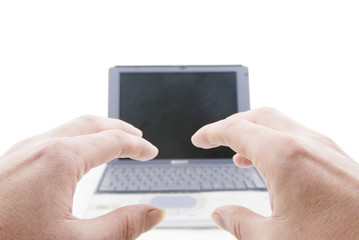 hands and silver laptop