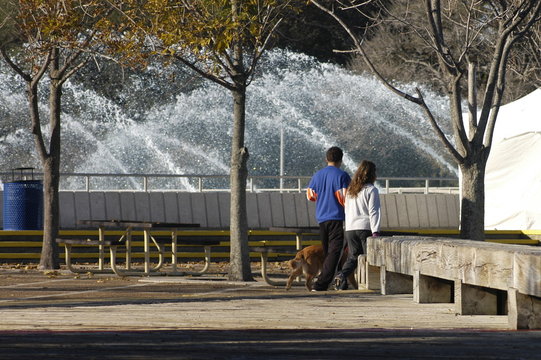 couple walking at fountain