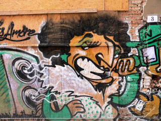 graffiti in a wall in the centre of bologna