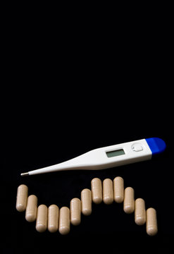 thermometer and pills.