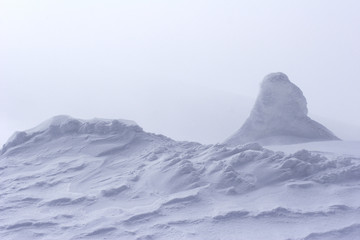 snow drift at top of mountain